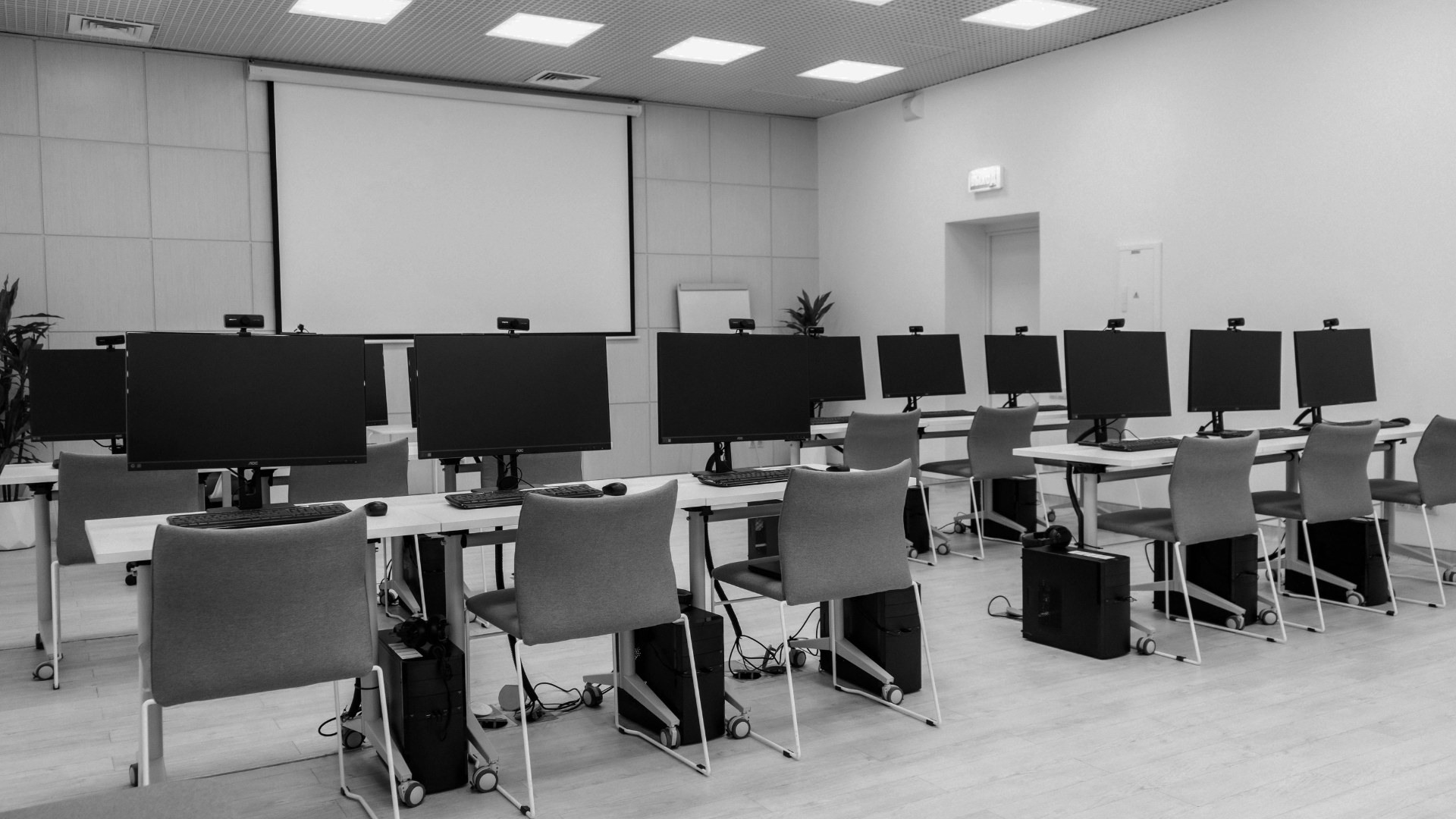 Rows of switched-off PCs in a computer lab after hours